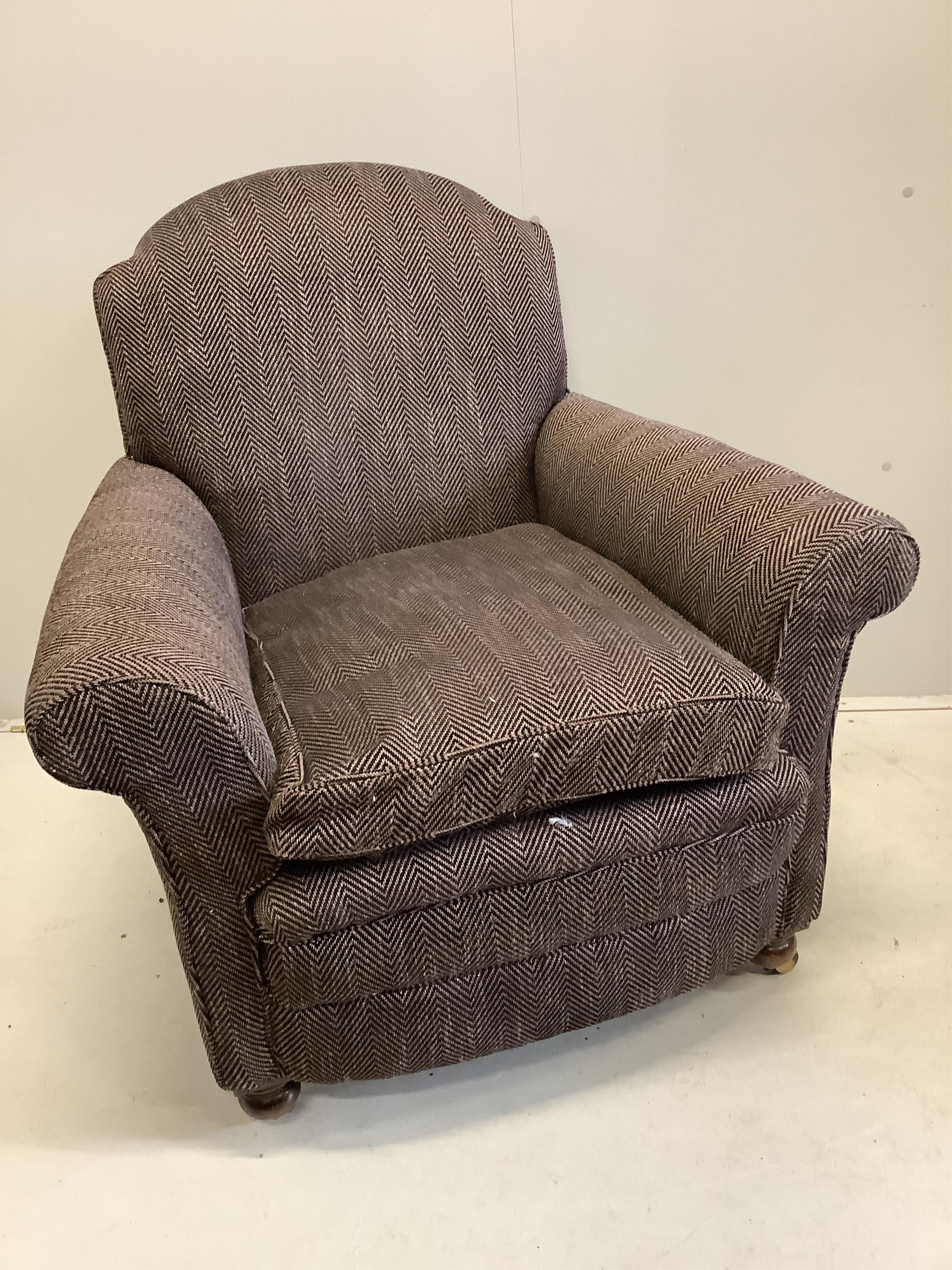 A near pair of early 20th century upholstered armchairs, recently upholstered, larger width 92cm, depth 90cm, height 98cm, together with a spare roll of upholstery fabric. Condition - good